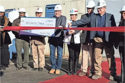  ??  ?? Employees and guests of Atlantic Track and Turnout Co. gathered for a ribbon-cutting Wednesday to open their new curved-rail production facility. The facility will support 20 new jobs. BRAD VEST/THE COMMERCIAL APPEAL