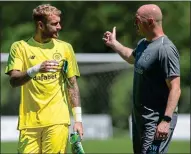  ??  ?? HELPING HAND: Bain (left) says he has improved his game thanks to Celtic goalkeepin­g coach Woods