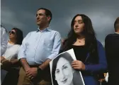  ?? JOANNA DEMARCO/GETTY ?? Members of the public stand at a vigil for journalist Daphne Caruana Galizia on Sunday at the spot where she was killed in Bidnija, Malta.