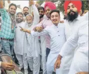  ??  ?? Congress supporters celebrate a party candidate's win in the Assembly election in Karnal on Thursday.
PTI