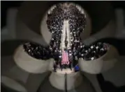  ?? ANDREW HARNIK — THE ASSOCIATED PRESS ?? The flag-draped casket of former President George H.W. Bush is carried out by a military honor guard during a State Funeral at the National Cathedral, Wednesday in Washington.