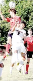  ?? PHOTO BY RICK PECK ?? McDonald County’s Alex Garcia (9) marks Carl Junction’s Connor Niemeyer as Niemeyer tries to head in a corner kick during the Bulldogs 3-1 win on Sept. 1 at the Loyce Shellnut Soccer Field at MCHS. Niemeyer missed on this attempt, but later scored on a...