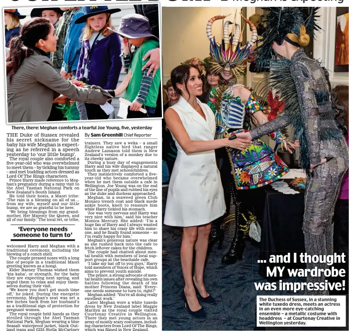  ??  ?? There, there: Meghan comforts a tearful Joe Young, five, yesterday The Duchess of Sussex, in a stunning white tuxedo dress, meets an actress in an even more eye-catching ensemble – a metallic costume with headdress – at Courtenay Creative in Wellington yesterday.