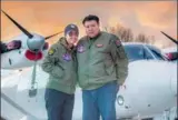  ?? PROVIDED TO CHINA DAILY ?? Zhang Xinyu and his wife, Liang Hong, with their twin-engine Y-12 plane before setting off on their trip.