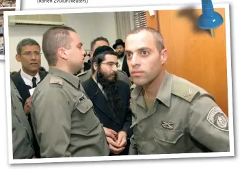  ?? (Ronen Zvulun/Reuters) ?? ‘RABBI’ ELIOR CHEN (center) is escorted by prison guards after his sentencing hearing at the Jerusalem District Court on February 28, 2011.