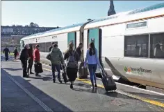  ??  ?? Passengers boarding the Rosslare-Dublin train at Enniscorth­y.