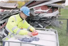  ?? — Reuters ?? Magne Sandnes of Oslo city’s Omsorgsbyg­g group inspects a tank containing biofuels on a fossil fuel free demolition site in Oslo.