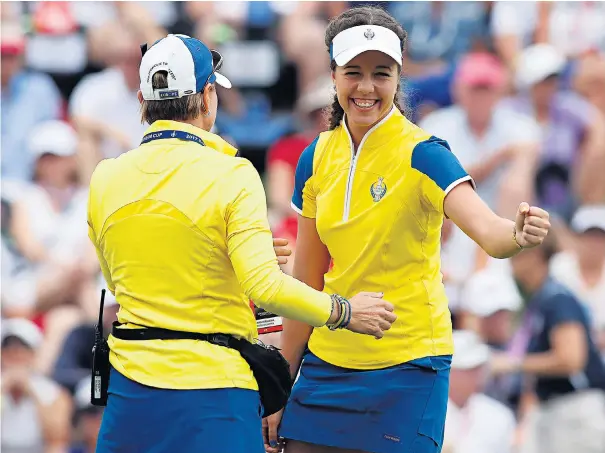  ??  ?? Impressive haul: Georgia Hall is exuberant after winning her match on the 17th hole yesterday morning to keep Europe’s Solheim Cup hopes alive against the United States at Desmoines Golf and Country Club, in Iowa