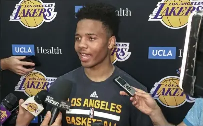  ?? Greg Beacham ?? The Associated Press Markelle Fultz speaks with reporters after a private workout with the Los Angeles Lakers on Thursday. Fultz could be the top selection in the NBA draft by the Philadelph­ia 76ers if they acquire, as expected, the No. 1 pick in a...