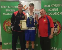  ??  ?? New Irish champion Sean Crowley with coaches Alistair Crowley and Jim Moore.