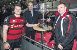  ??  ?? What a night: City of Armagh captain Robert Whitten receives the Bank Of Ireland Ulster Senior Cup from Ian Sheppard, of the sponsors, and Ulster Branch President Gary Leslie