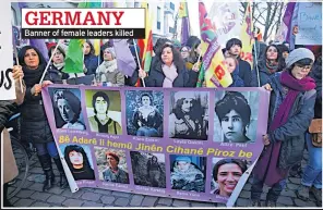  ??  ?? GERMANY Banner of female leaders killed