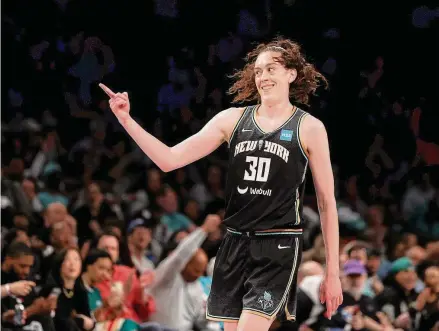  ?? Elsa/Getty Images ?? The Liberty’s Breanna Stewart celebrates after make a 3-pointer against the Fever at Barclays Center on Sunday in the Brooklyn. Stewart scored a franchise record 45 points in a 90-73 win.