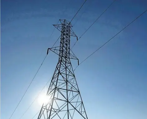  ?? DARREN CALABRESE/THE CANADIAN PRESS ?? A hydro tower is shown in Toronto. The Ontario government’s plan to lower hydro rates, which have roughly doubled over the last decade, is expected to cost taxpayers $21 billion over the next 30 years, according to the province’s budget watchdog.