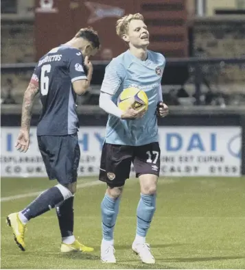  ??  ?? 0 Hearts winger Gary Mackay-steven celebrates his second goal against Raith Rovers