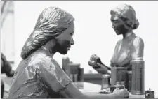  ?? SETHJ ?? The bronze sculpture Soda Fountain by Georgia Gerber stands in a park near the former Dockum Drug Store, the site of the civil rights movement’s first successful youth-driven lunch-counter sit-in.