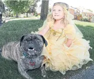  ?? RON PIETRONIRO/METROLAND ?? Emma Wilson with her dog, Copper — a four-year-old puggle, which suffered a broken back in an accident.