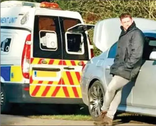  ??  ?? Blocking the view: Chris Welford with the boot of his car raised to stop the mobile speed camera photograph­ing any drivers