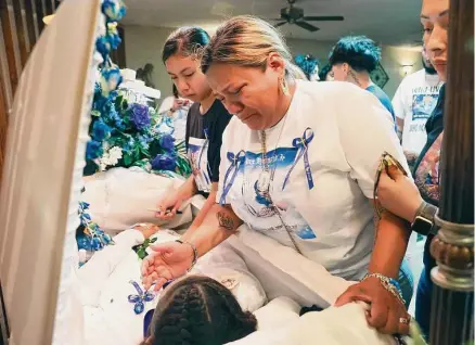  ?? Photos by Jerry Lara/staff photograph­er ?? Lynda Espinoza mourns her son, 13-year-old Andre “AJ” Joseph Hernandez, during funeral services at San Antonio Mortuary on Friday. The boy was shot and killed June 3 in a confrontat­ion with San Antonio police on the Southwest Side.