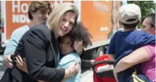  ?? NATHAN DENETTE/THE CANADIAN PRESS ?? Ontario NDP Leader Andrea Horwath, left, receives a hug from 6-year-old Jasmine Orchard during a campaign stop in Toronto on Friday.