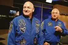  ?? Associated Press file photo ?? NASA astronaut Scott Kelly, left, and his twin, Mark, joke around before a news conference in 2016.