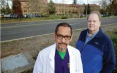  ??  ?? WASHINGTON: Dr Joseph Wainer, left, a psychiatri­st at Western State Hospital, and Paul Vilja, right, a nursing supervisor, pose for a photo near the facility in Lakewood. — AP