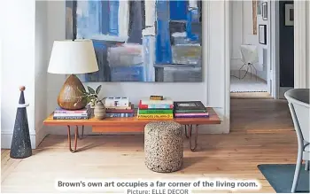  ?? Picture: ELLE DECOR ?? Brown’s own art occupies a far corner of the living room.