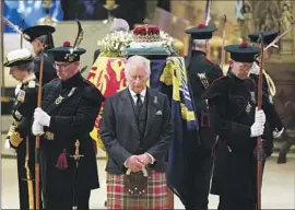  ?? Jane Barlow Pool Photo ?? IN EDINBURGH, Scotland, King Charles III, center, and other members of the royal family hold a vigil at the coffin of Queen Elizabeth II at St. Giles’ Cathedral.