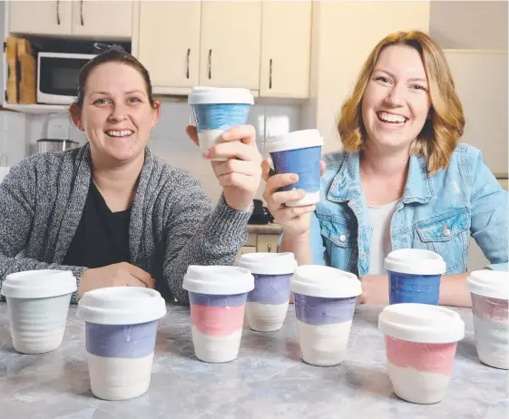  ?? Picture: RICHARD GOSLING ?? Kylah Rumble and Brittany Frost have made ceramic coffee cups to replace paper coffee cups through their business the Ceramic Mill.