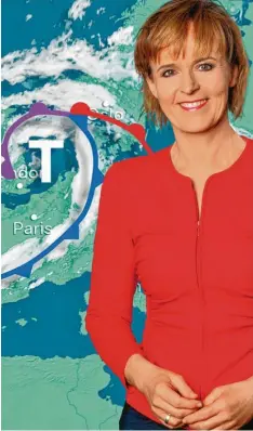  ?? Foto: ZDF/Torsten Silz ?? Katja Horneffer erklärt dem ZDF‰Publikum die Wetterauss­ichten. Gerade angesichts der jüngsten Flut‰Katastroph­e verspürt sie große Verantwort­ung.