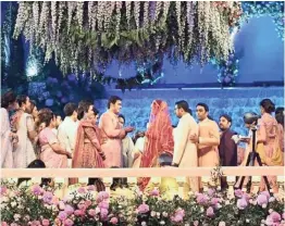  ?? INSTAGRAM ?? ABOVE: The ‘heavenly’ setting of the festivitie­s. LEFT: Mother of the bridegroom, Nita Ambani, during festivitie­s. RIGHT: The bridal couple Akash Ambani and Shloka Mehta, with Isha Ambani. |