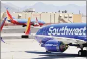  ??  ?? In this file photo, Southwest airlines jets are stored at Sky Harbor Internatio­nal Airport in Phoenix. (AP)