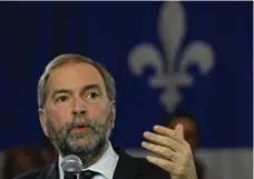  ?? JIM YOUNG/REUTERS FILE PHOTO ?? As counterint­uitive as it seems, the election likely consolidat­ed Quebec’s hand within the Thomas Mulcair’s federal NDP says Chantal Hébert.