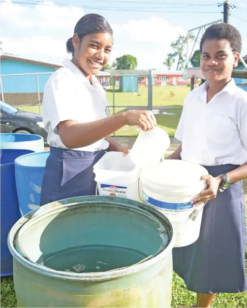  ?? Photo: Ronald Kumar ?? Jeremiah Raibevu College students, Naelani Nagone and Ledua Waqabaca fill water rationed following the water cut in Tacirua, Tamavua, on April 13, 2023.