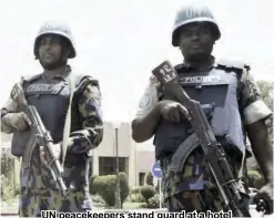  ??  ?? UN peacekeepe­rs stand guard at a hotel entrance in Bamako, Mali, in 2015