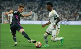  ?? Photograph: JJ Guillen/EPA ?? Vinícius Júnior takes Joshua Kimmich to a dark place in Real Madrid’s dramatic victory against Bayern.