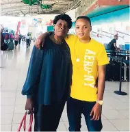  ?? CONTRIBUTE­D ?? National senior women’s striker Trudi Carter (right) and her mother Lucille Hamilton sharing a hug recently at the Norman Manley Internatio­nal Airport.