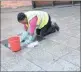  ??  ?? READY: Lindiwe Mkhize cleans the floors of the Pietermari­tzburg central train station before Indian Prime Minister Narendra Modi’s visit today.