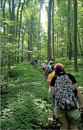  ?? PHOTO COURTESY FRIENDS OF ROGERS ?? Young naturalist­s explore the trails during a recent program at Rogers Center.