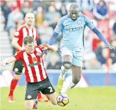  ?? — Reuters photo ?? Sunderland’s Billy Jones in action with Manchester City’s Yaya Toure (right) during the English Premier League match at Stadium of Light in this March 5, 2017 file photo.