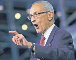  ??  ?? The bitter-enders: Clinton campaign chief John Podesta, here telling the crowd on election night to go home, still can’t accept the loss.