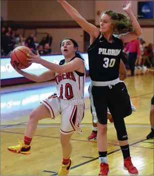  ?? Photo by Jerry Silberman / risportsph­oto.com ?? Tolman senior guard Julia Al-Amir (10) attempts a shot with Pilgrim’s Nadine Ogni (30) on her back in the first half of the No. 1 Tigers’ 37-26 victory to claim the Division III title Sunday.