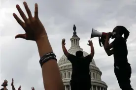  ??  ?? Demonstrat­ors protest the death of George Floyd as they gather on the East side of the US Capitol in Washington on 3 June 2020. Photograph: Jacquelyn Martin/AP