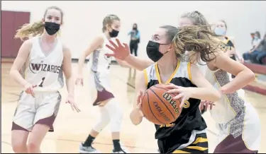  ?? EDDIE HERZ / Loveland Reporter-herald ?? Thompson Valley freshman Paige Wagner drives toward the basket against Windsor on Thursday.