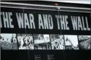  ?? MARIAN DENNIS – DIGITAL FIRST MEDIA ?? The truck carrying “The Wall That Heals” displays photos from the Vietnam War. The mobile replica of the Vietnam War Memorial was transporte­d Thursday from Sunnybrook Ballroom in Lower Pottsgrove to Daniel Boone High School, escorted by a parade of...