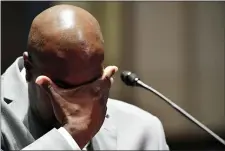  ?? MANDEL NGAN — POOL VIA AP ?? Philonise Floyd, a brother of George Floyd, wipes his face as he testifies during a House Judiciary Committee hearing Wednesday on proposed changes to police practices and accountabi­lity.