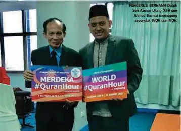  ??  ?? PENGERUSI BERNAMA Datuk Seri Azman Ujang (kiri) dan Ahmad Tarmizi memegang sepanduk WQH dan MQH.