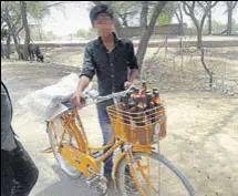  ?? HT ?? A minor boy with his bicycle loaded with liquor bottles in Bikaner.