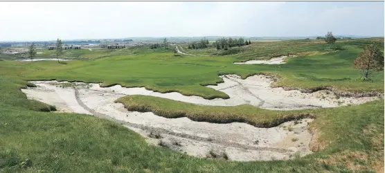  ?? JIM WELLS ?? The difficult bunker features are shown during a tour at Mickelson National Golf Club. The course, which is expected to be fully open in 2020, flanks Harmony’s east side.