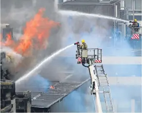  ??  ?? ■
Crews tackle the devastatin­g blaze at Glasgow School of Art in 2014.